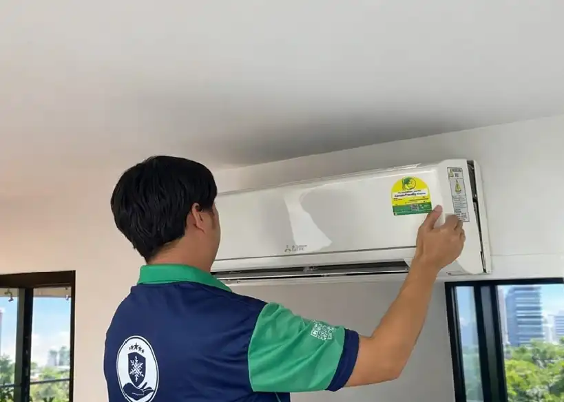 CoolTrust technician removing aircon cover and filters