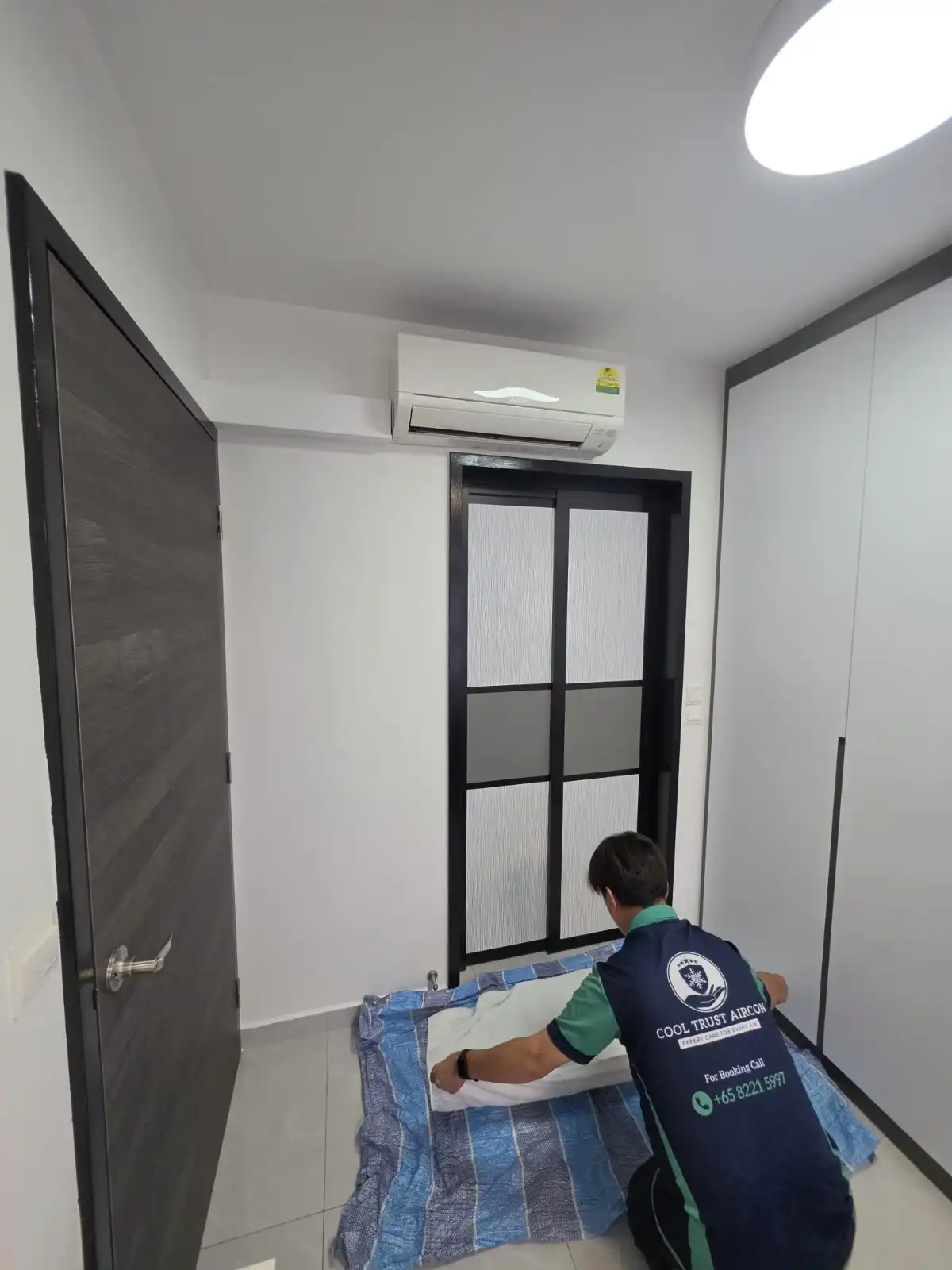 CoolTrust technician protecting the aircon servicing area